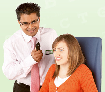 Photo of an Optician examining a patient